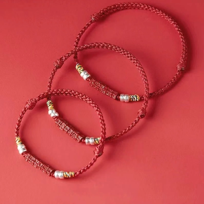 Handmade Buddhist blessing bracelet with natural materials highlighting artisanal craftsmanship and authenticity