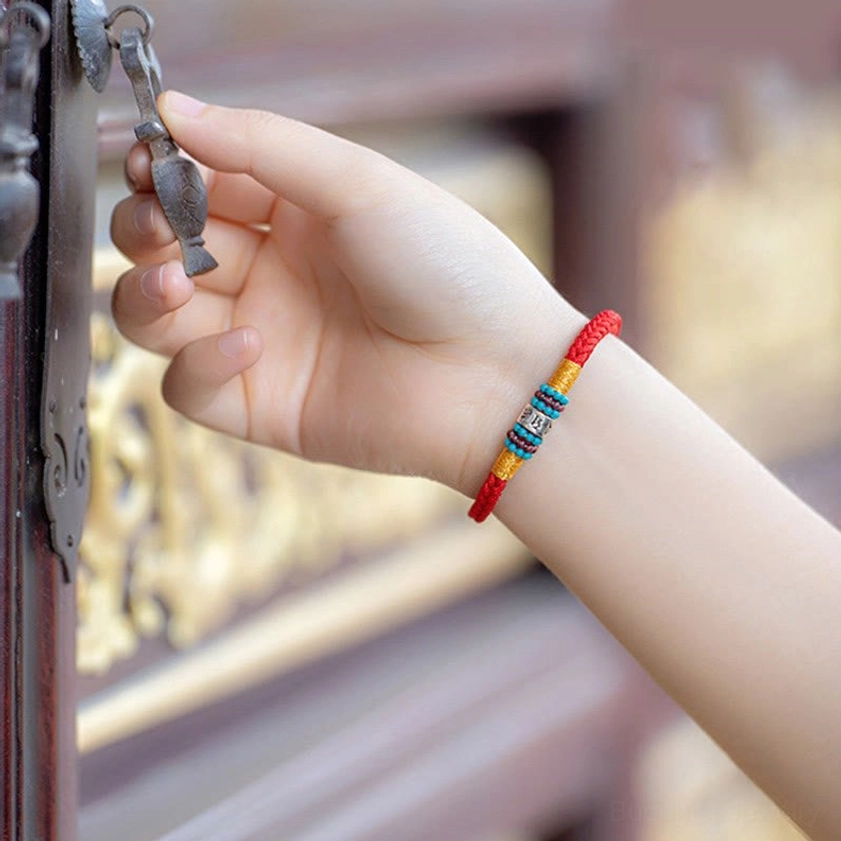 Artisan-crafted Buddhist bracelet highlighting handmade quality and spiritual craftsmanship