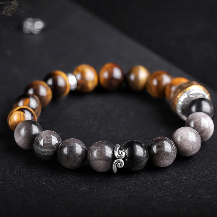 Premium handcrafted Silver Sheen Obsidian and Tiger's Eye beaded bracelet featuring sacred Om Mani Padme Hum charm and elastic cord design