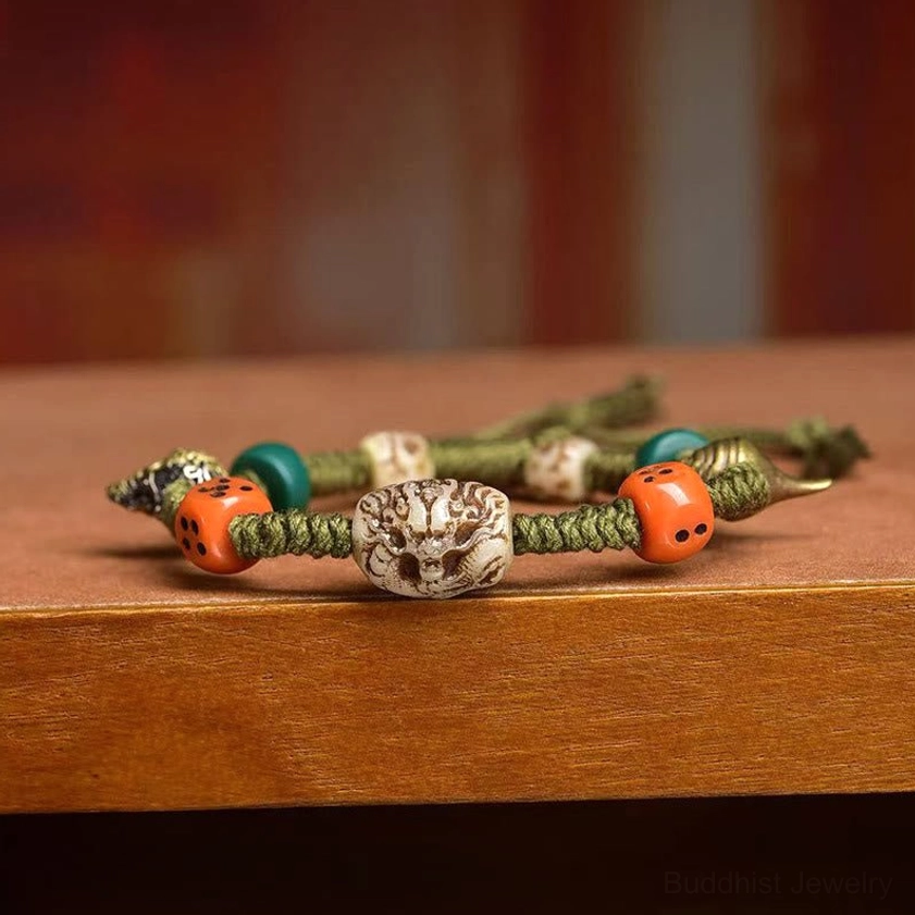 Flat lay display of multiple handmade Buddhist rope bracelets stacked together