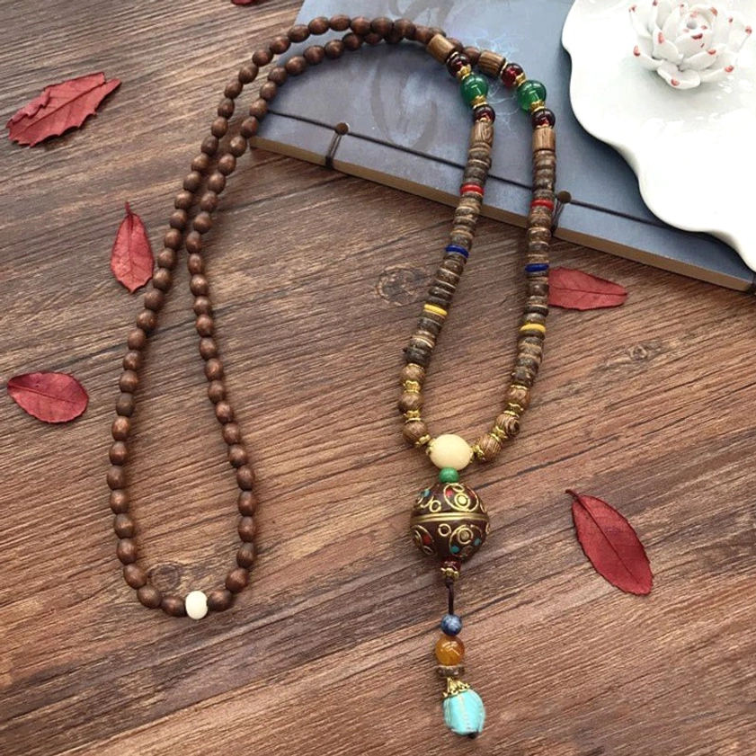 Authentic handmade Buddhist necklace showcasing natural coconut shell and Schima wood craftsmanship