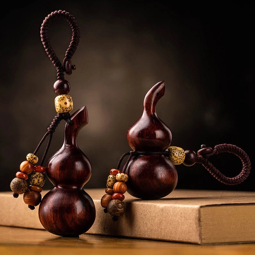 Handmade Buddhist gourd keychain showing artisan craftsmanship with natural wood variation and cultural spiritual symbolism