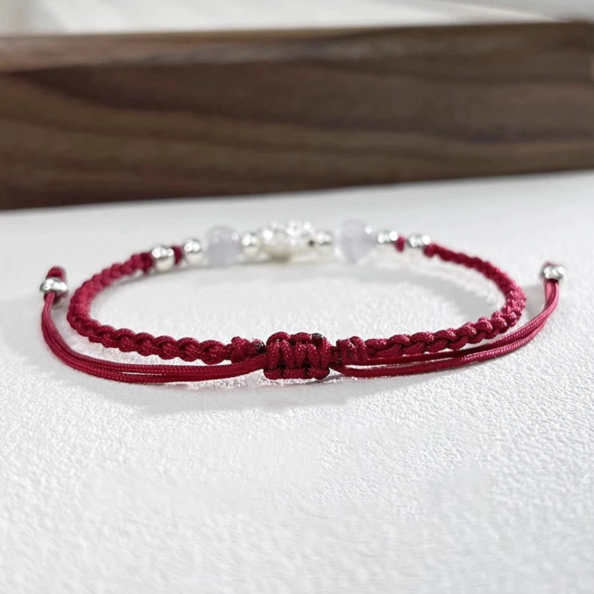 Handmade Buddhist lotus bracelet collection showing multiple color variations and design details