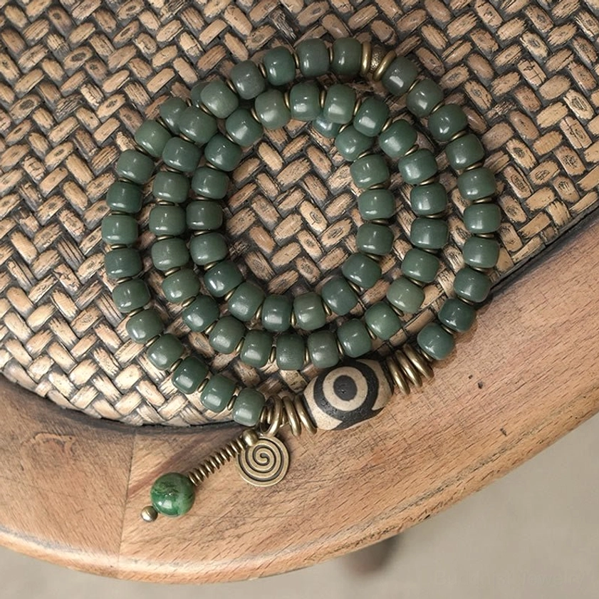Handmade Buddhist prayer and meditation bracelet featuring sacred bodhi seeds and protective dzi beads