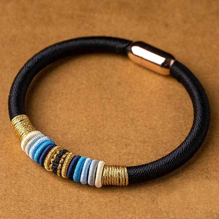 Handmade Buddhist protection bracelet detail shot showing braided cord quality