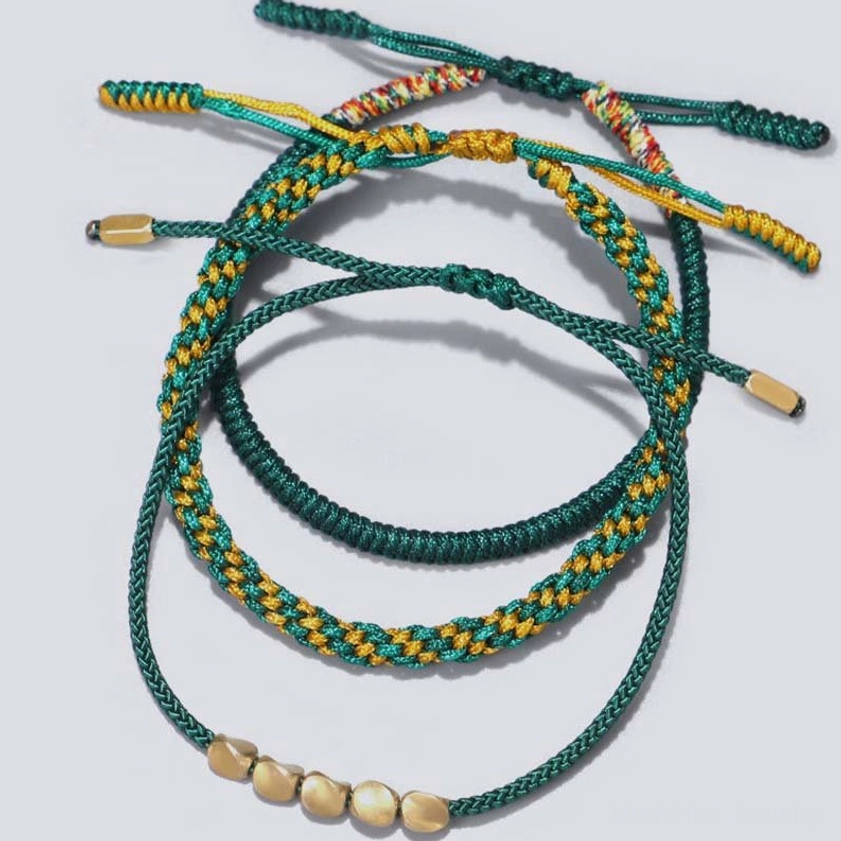 Handcrafted copper beaded bracelet with detailed bead work and traditional woven cord