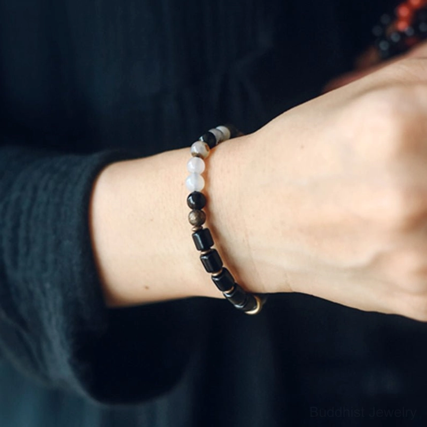Handmade ebony gemstone Buddhist bracelet with natural materials showing authentic craftsmanship and spiritual detail