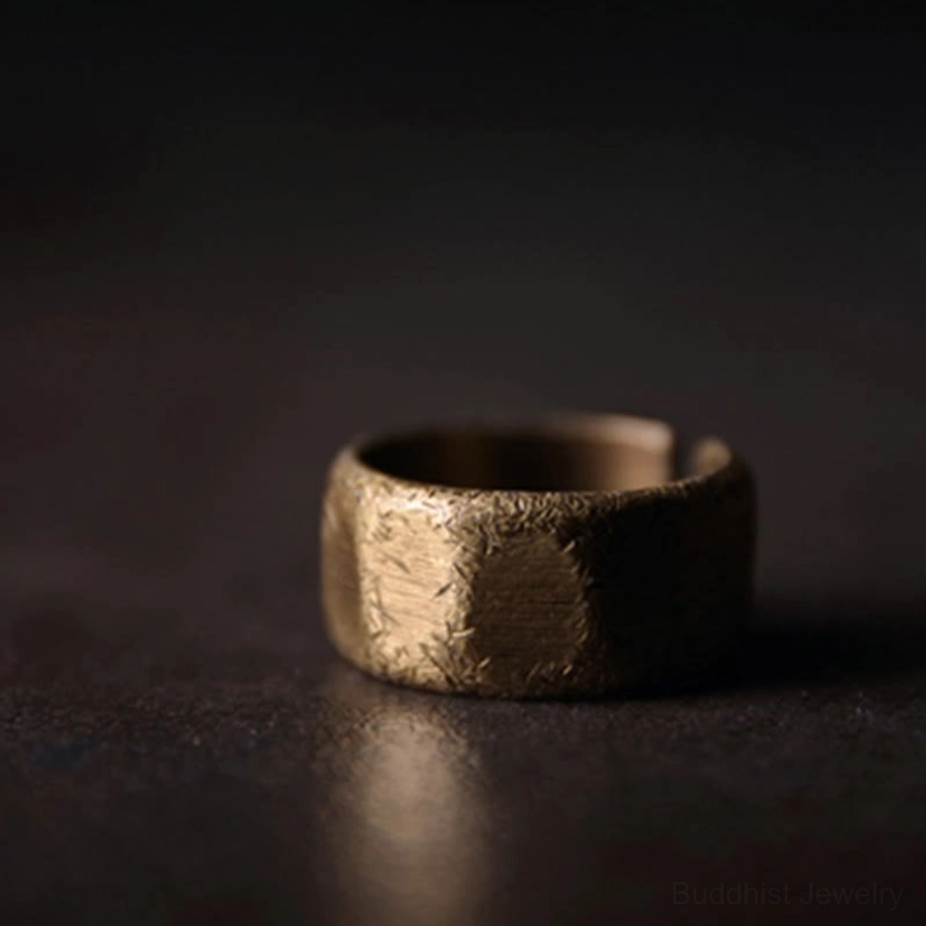Handmade frosted copper brass Buddhist wealth ring showing natural craftsmanship and unique character