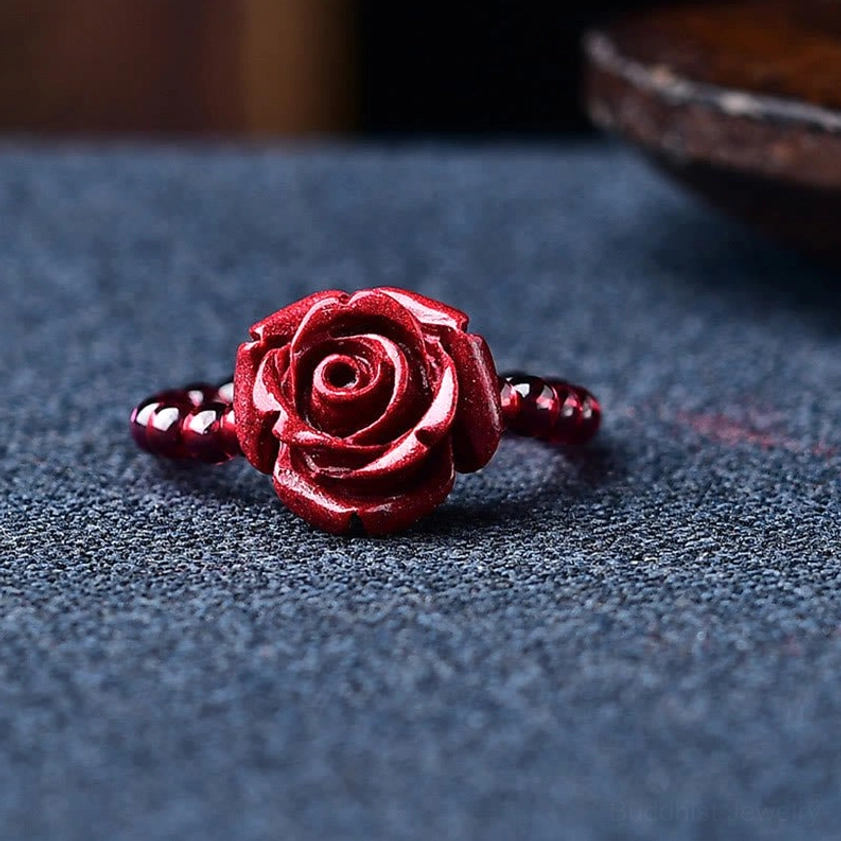 Handmade garnet cinnabar Buddhist ring with protective PiXiu symbol, natural burgundy beads, and sacred mantra for chakra balancing and spiritual practice