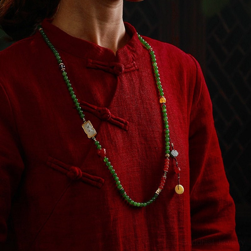 Handmade jade mala beads showing natural color variation and texture detail