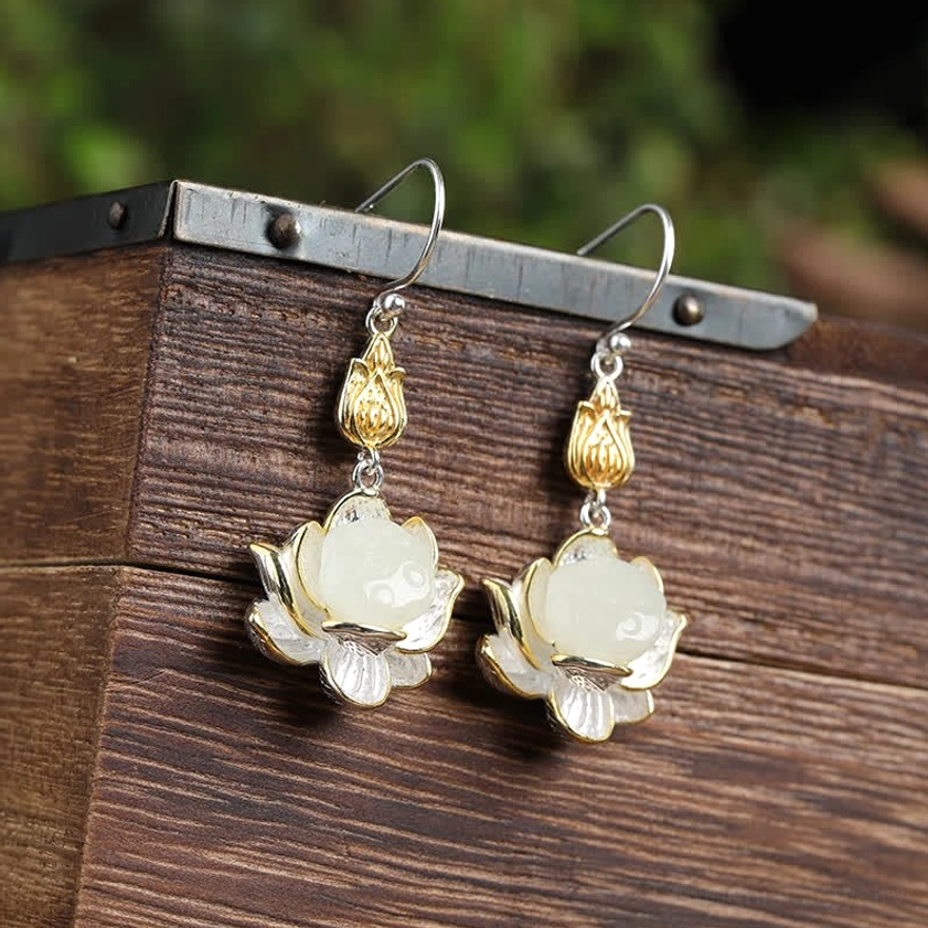 Handmade Buddhist lotus jade earrings highlighting natural stone texture and artisan metalwork craftsmanship