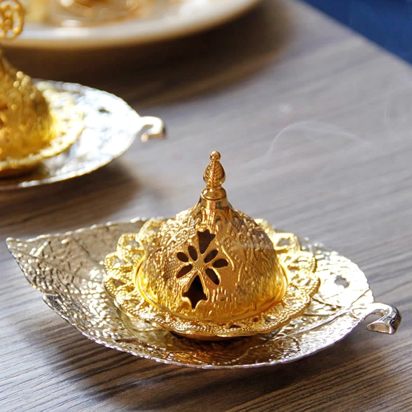 Handmade metal incense burner showing craftsmanship details and natural material quality