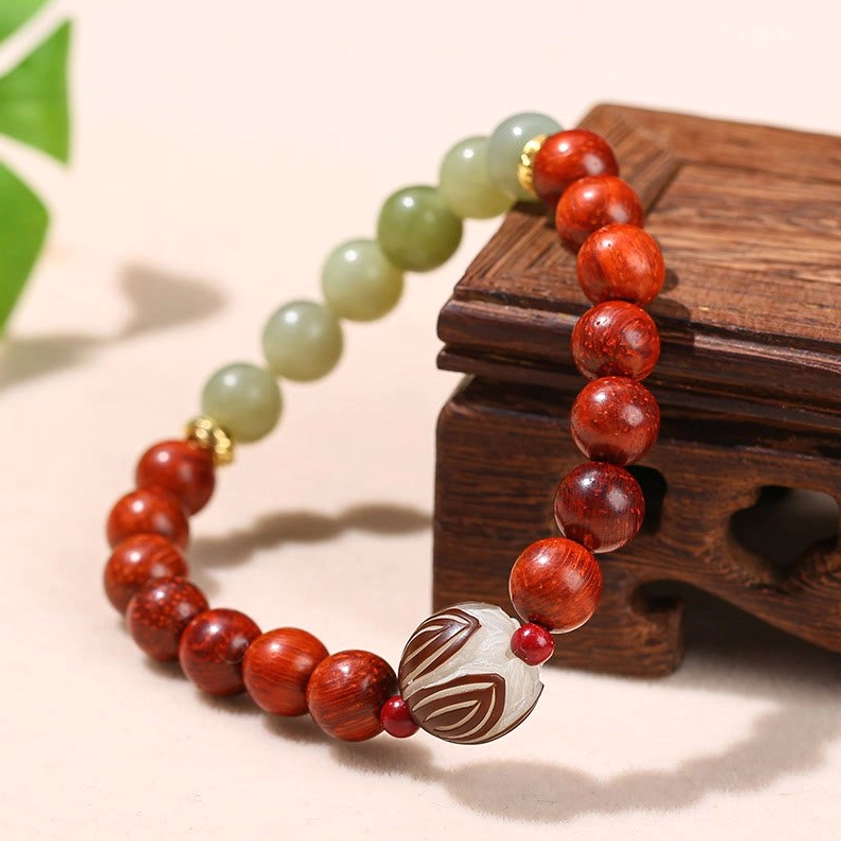 Handcrafted natural rosewood and cyan jade bracelet featuring authentic lotus Bodhi seed with elastic cord construction