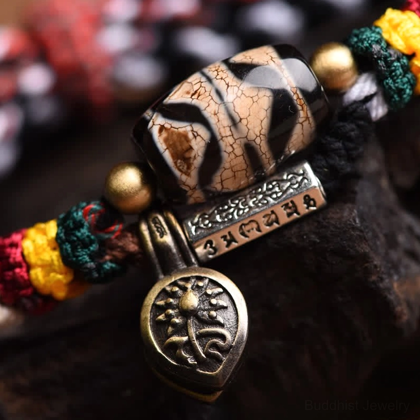 Handmade nine-eye dzi bead Om Mani Padme Hum bracelet with copper components and braided cord