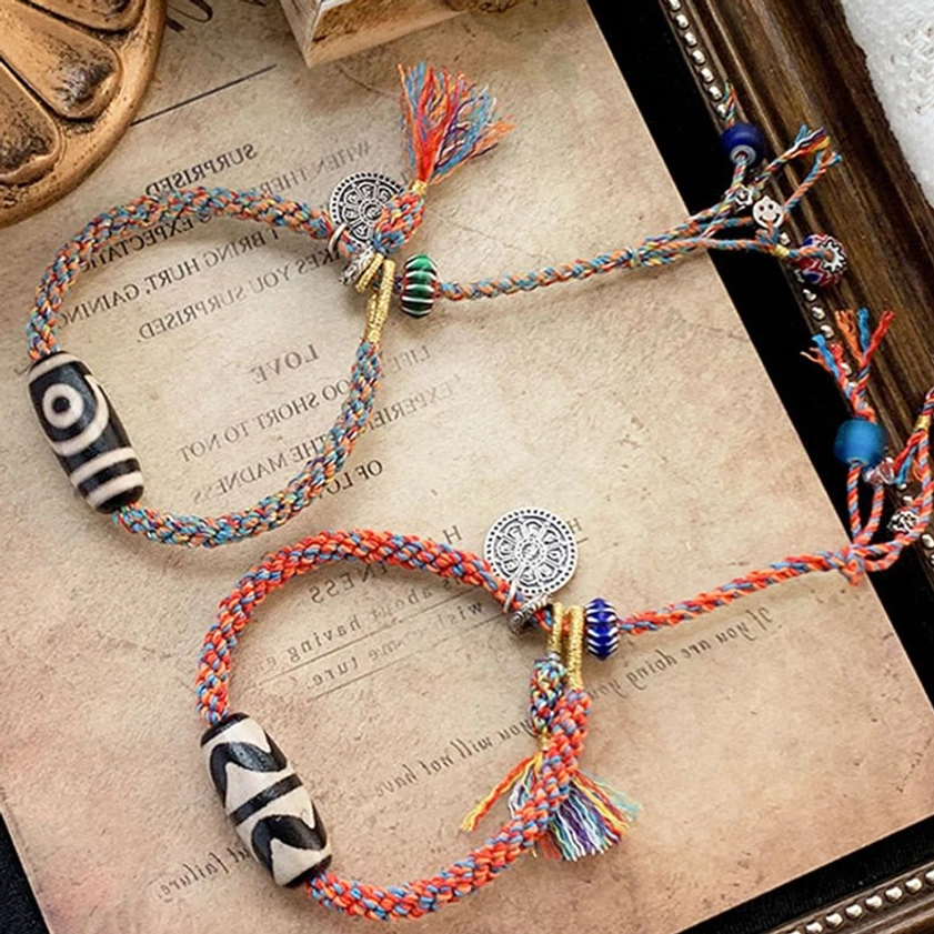 Handmade Nine-Eye Dzi Bead Om Mani Padme Hum sterling silver bracelet showcasing traditional craftsmanship and sacred Buddhist symbolism