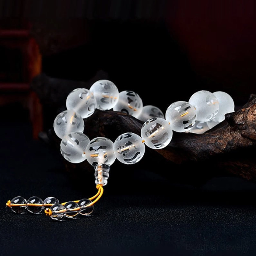 Handmade Buddhist prayer bracelet with Om Mani Padme Hum engraved beads and golden tassel