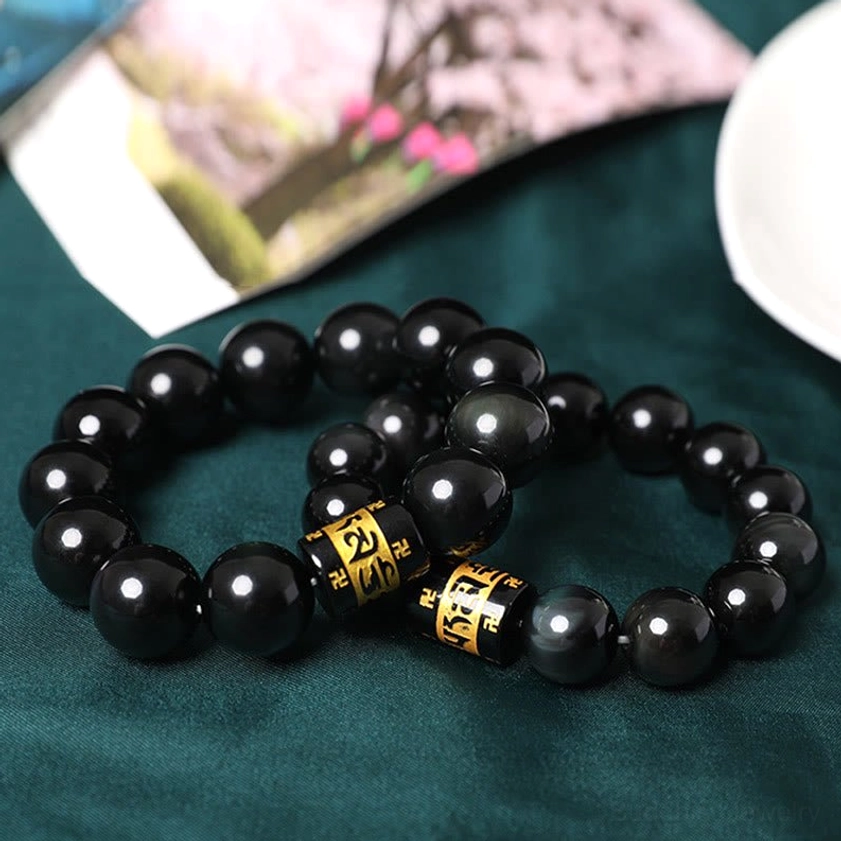Handmade rainbow obsidian Buddhist prayer bracelet - natural stone artisan craftsmanship detail