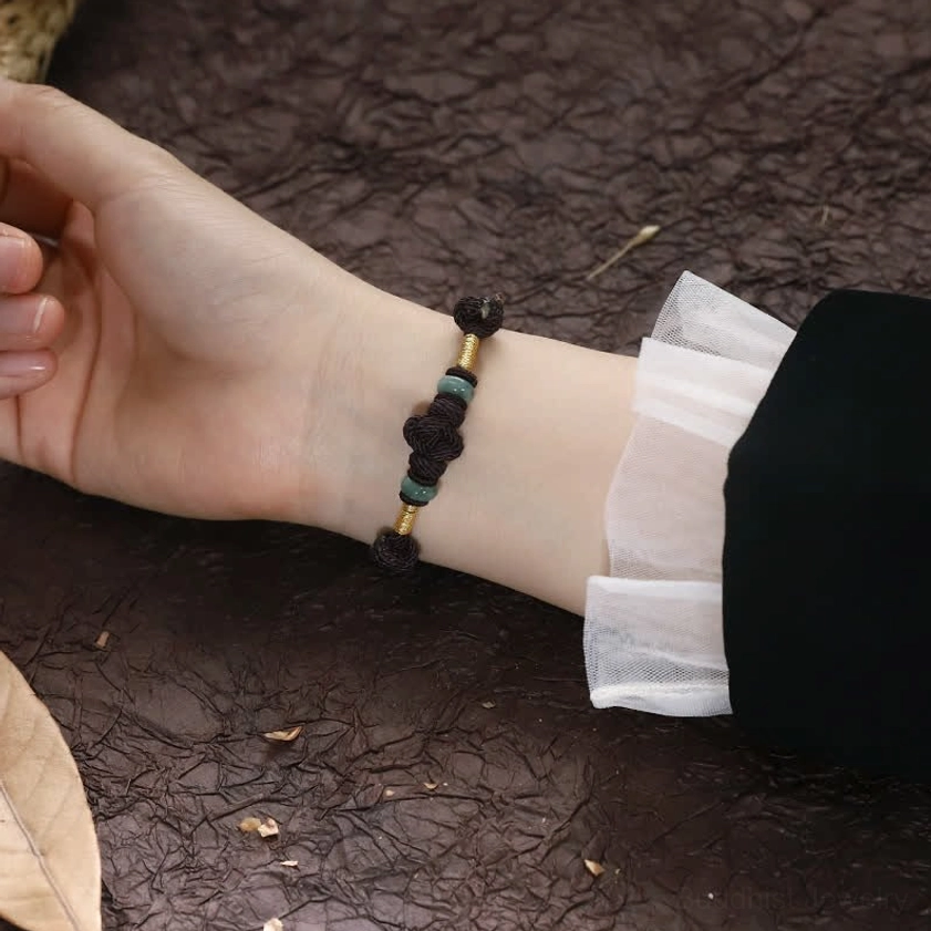 Handmade red jade Buddhist bracelet detail showing natural materials and artisanal craftsmanship