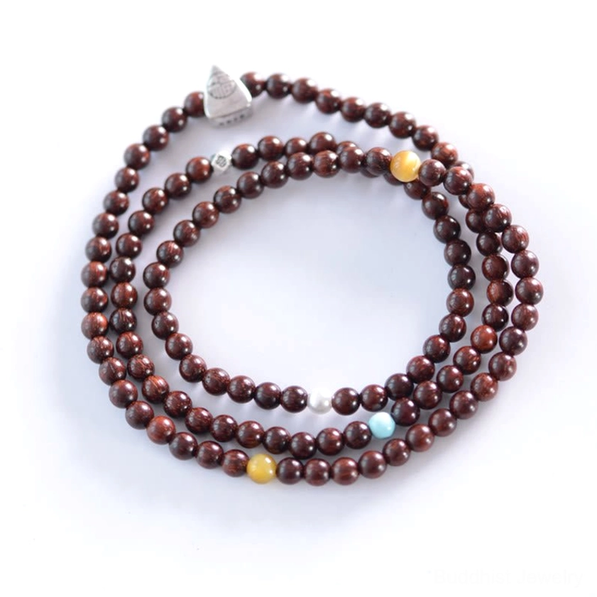 Handmade red sandalwood Buddhist bracelet featuring Fu character charm and tiger eye turquoise beads