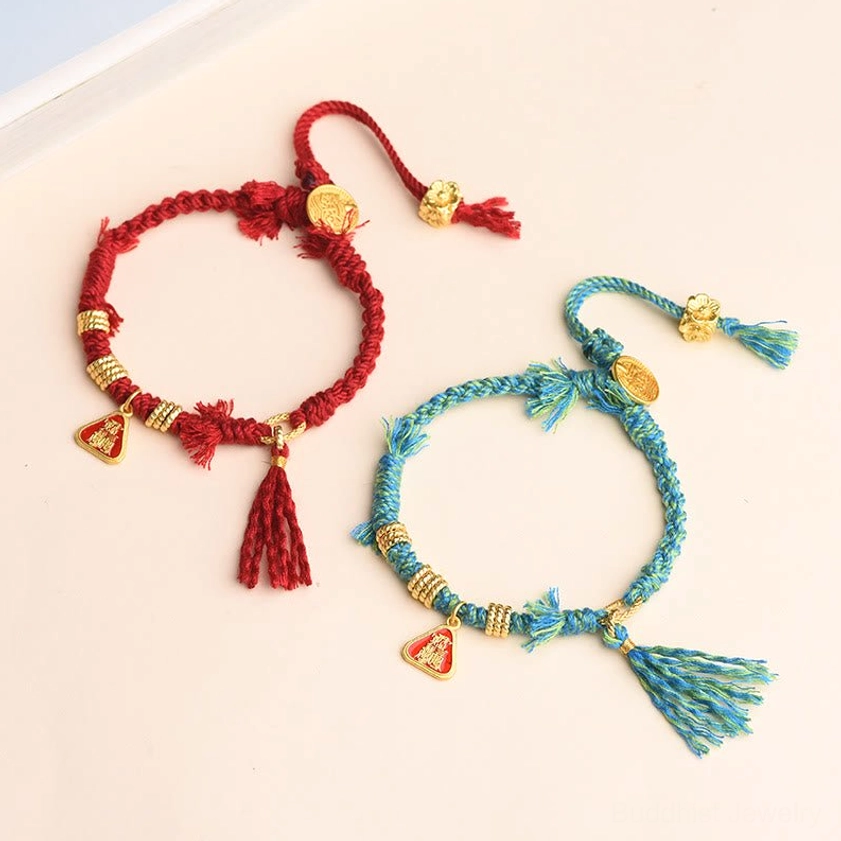 Handmade red string goddess protection bracelet highlighting natural materials, braided craftsmanship, and authentic spiritual design