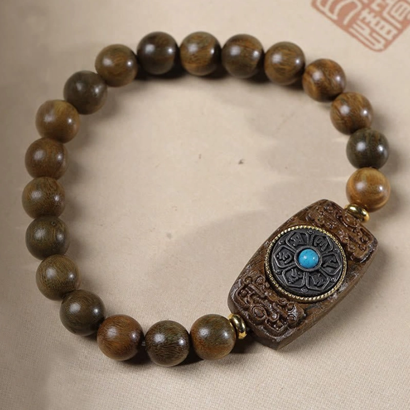 Handmade sandalwood Buddhist bracelet showing individual bead quality and craftsmanship details
