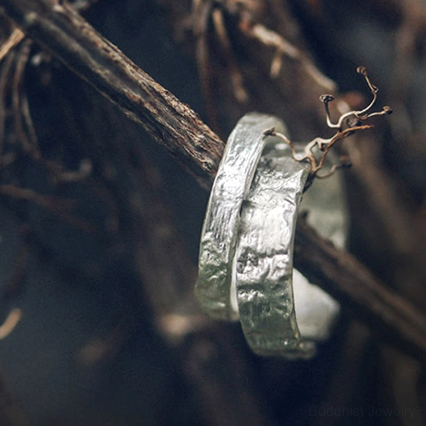 Handcrafted silver hammered texture couple rings, artisan-made with natural materials