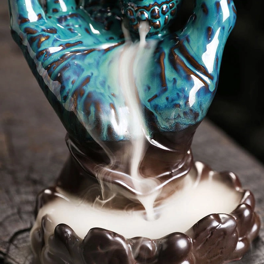 Eco-friendly handmade ceramic skull hand incense burner for Buddhist spiritual practice