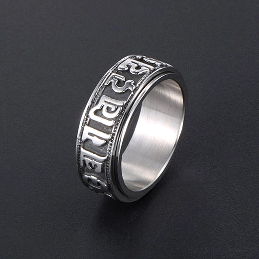 Handmade titanium steel mantra spinner ring showing authentic craftsmanship details