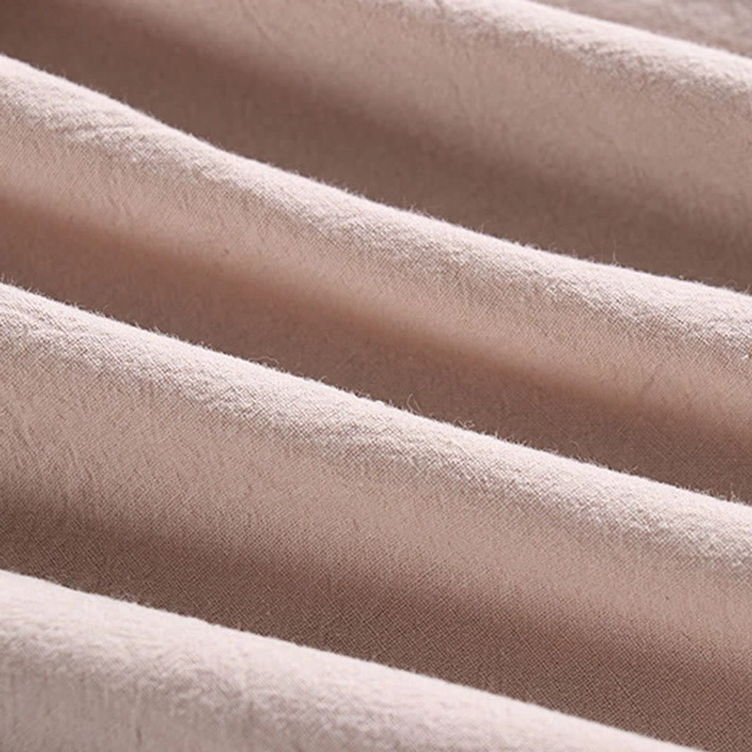 Soft matte woven cotton fabric texture – natural light beige color flat lay close-up