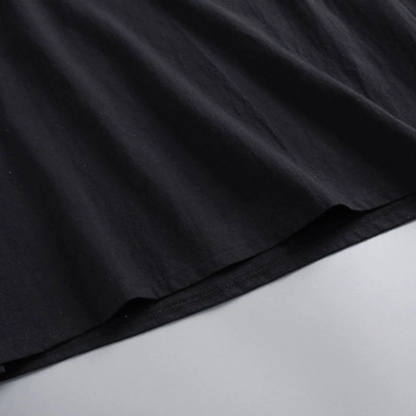 Close-up of Hanfu pants side slit hem with drape and matte black fabric