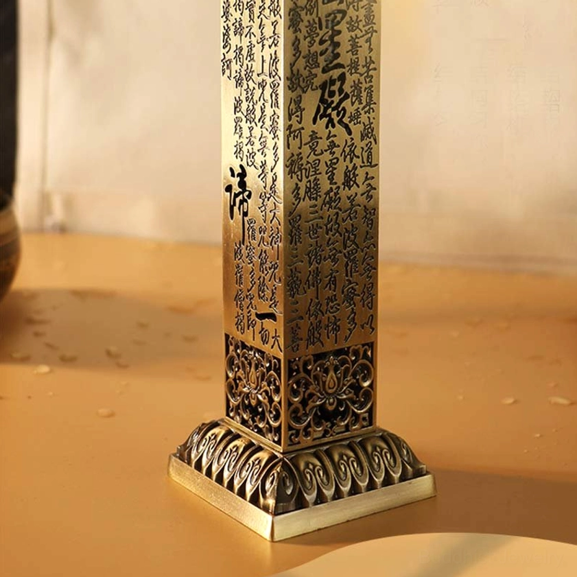 Copper incense burner with lotus-carved base, square metal body, and engraved Buddhist scriptures