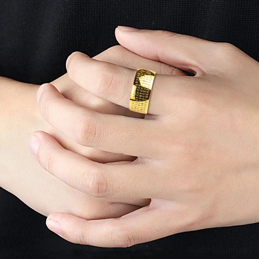 Gold Heart Sutra Buddhist ring worn on hand showing comfortable fit and polished wide band