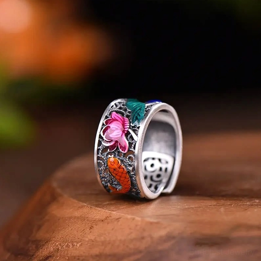 Heart Sutra Buddhist ring with blue enamel lotus and koi fish design showcasing craftsmanship detail and copper metal finish