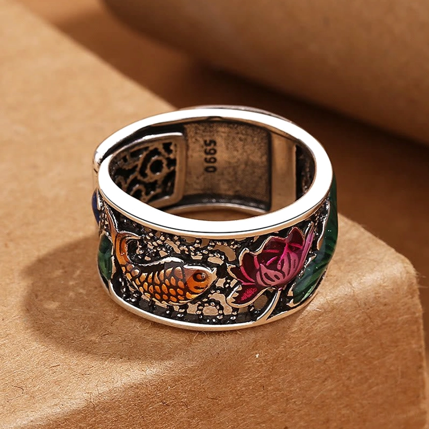 Top-down view of adjustable open-band Heart Sutra lotus koi fish ring on wooden display block showing S990 inner mark and cloisonne detailing