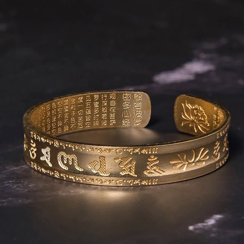 Heart sutra lotus brass bangle with handcrafted Sanskrit engraving and spiritual symbolism