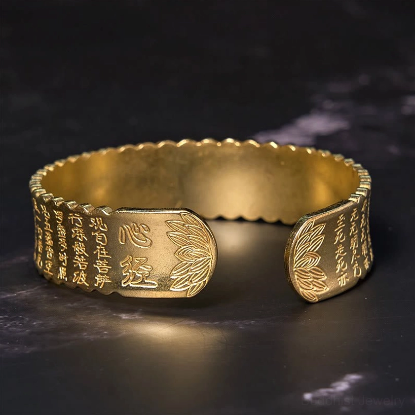 Three-quarter view of Heart Sutra lotus brass cuff bracelet showing intricate sutra inscription and lotus design in antiqued finish