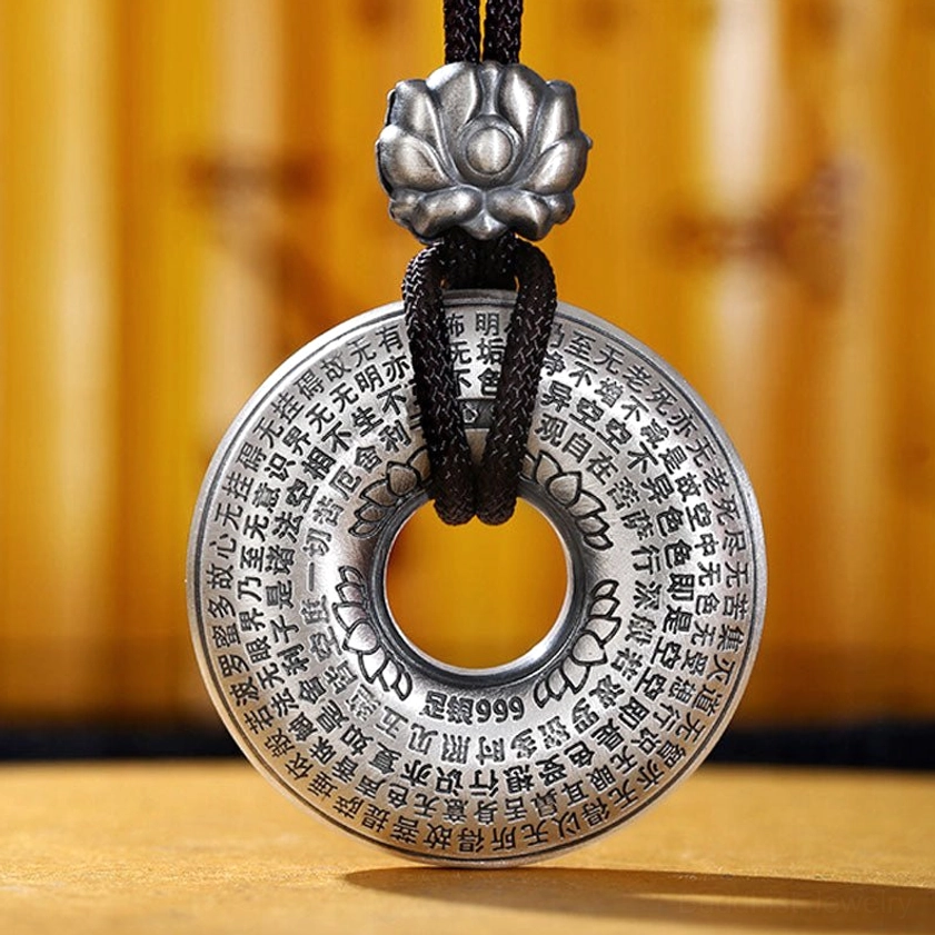 Back View Close-up of Sterling Silver Heart Sutra Peace Buckle Pendant Showing Full Circumferential Sutra Engravings