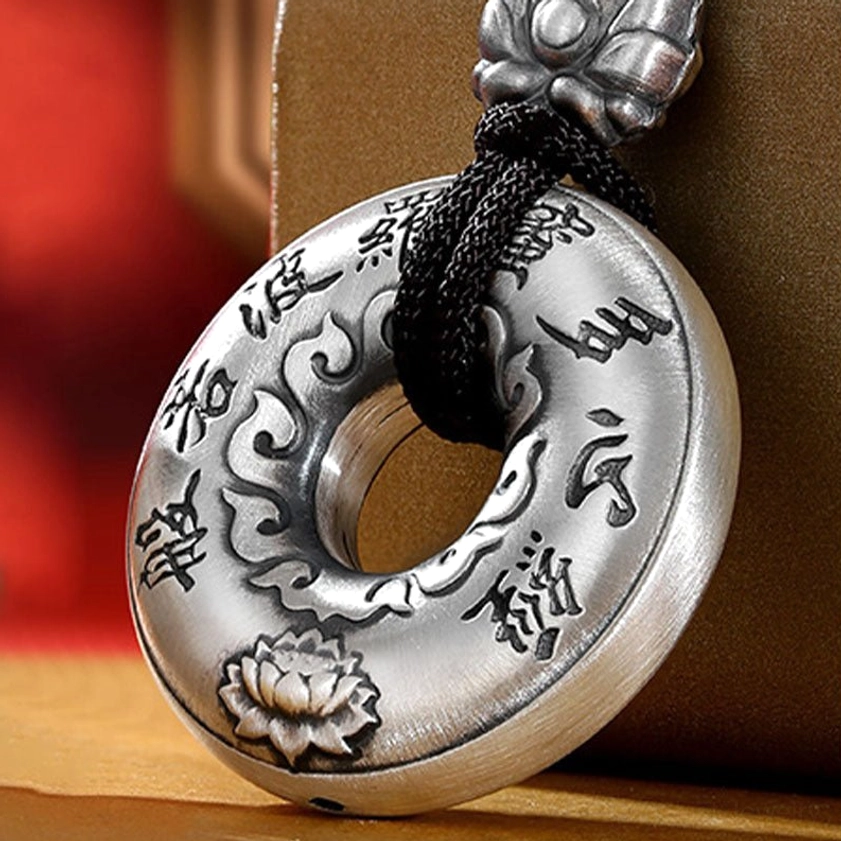 Close-up Detail of 999 Sterling Silver Heart Sutra Peace Buckle Pendant with Engraved Sutra Text