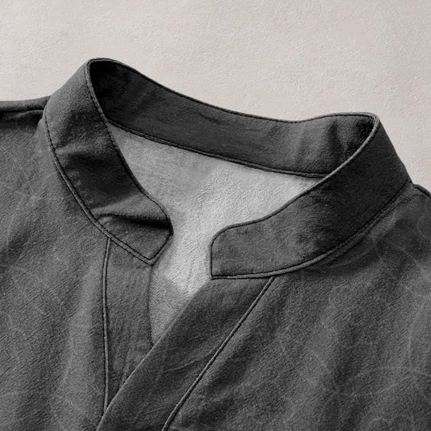 Buddhist henley shirt stand collar close-up detail notched neckline neat stitching