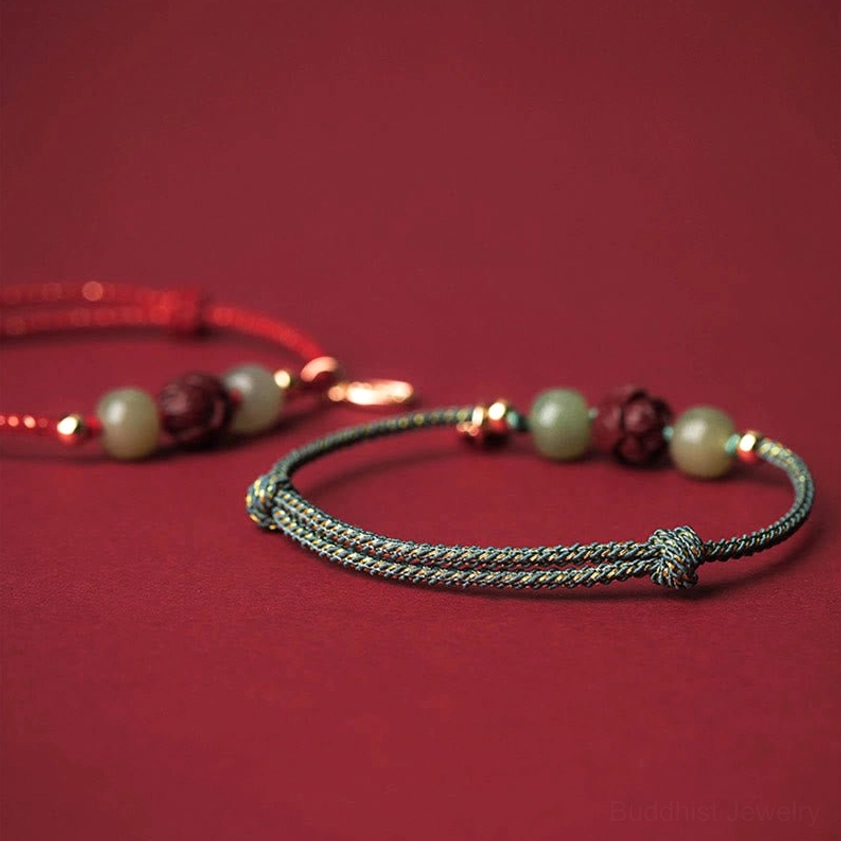 Premium Hetian jade beads in natural light showing authentic color and polish, hand-selected for Buddhist luck and prosperity bracelet
