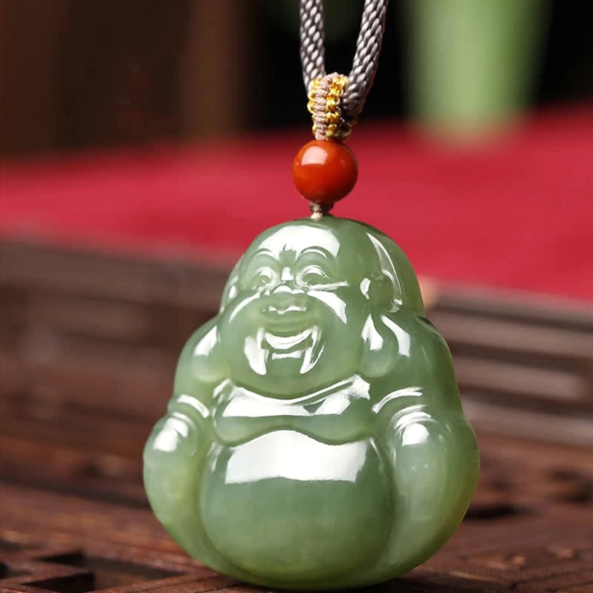Hetian jade Maitreya Buddha pendant necklace complete front view showing smiling Buddha face on wooden table