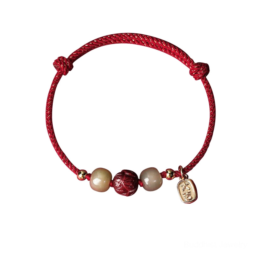 Complete red cord Buddhist luck bracelet with hand-carved cinnabar lotus pendant, smooth Hetian jade beads, and 14K gold charm, handmade spiritual jewelry