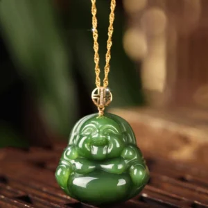Hetian jade laughing Buddha necklace front view with 925 sterling silver chain and 18K gold clasp on wooden display