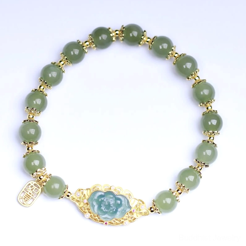 Complete Hetian jade beaded bracelet top-down view on light background, showing uniform green jade beads, gold spacers, central lotus charm, and dangling luck tag