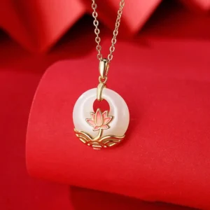 Hetian white jade lotus flower pendant necklace with sterling silver, close-up front view on red fabric background showing hand-carved lotus detail