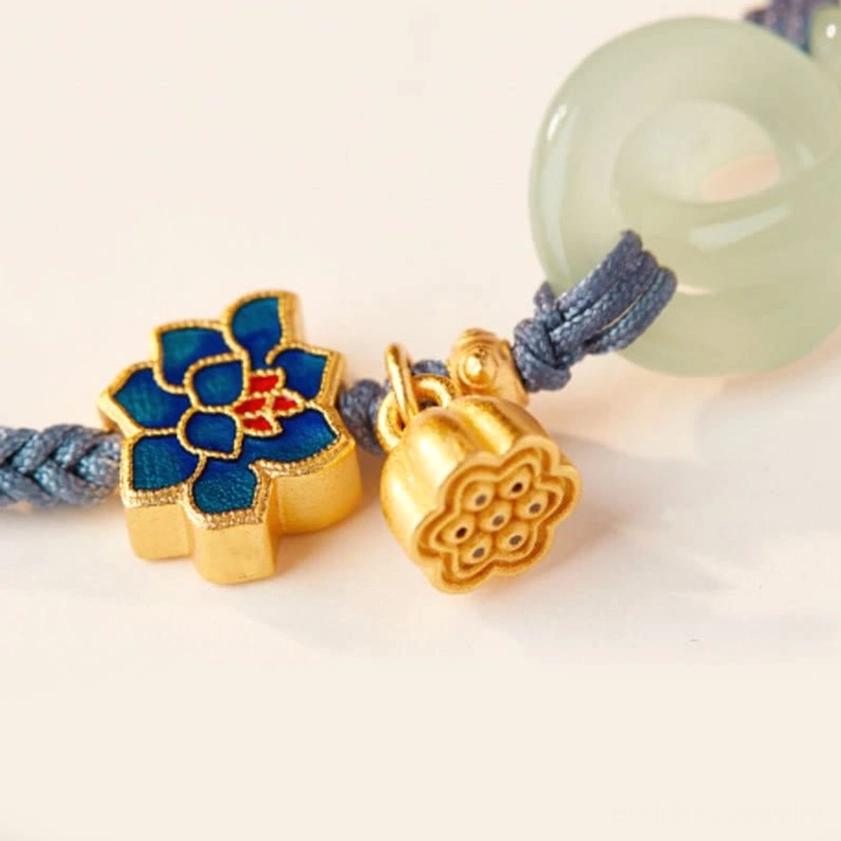 Hetian jade peace buckle lotus bracelet close-up showing craftsmanship and natural jade coloring