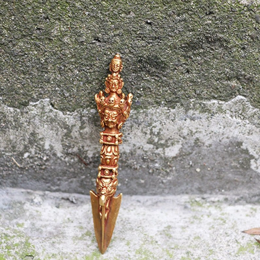 Product lifestyle image showing how to hold and use Vajra Dorje for meditation, spiritual practice, and ritual ceremonies