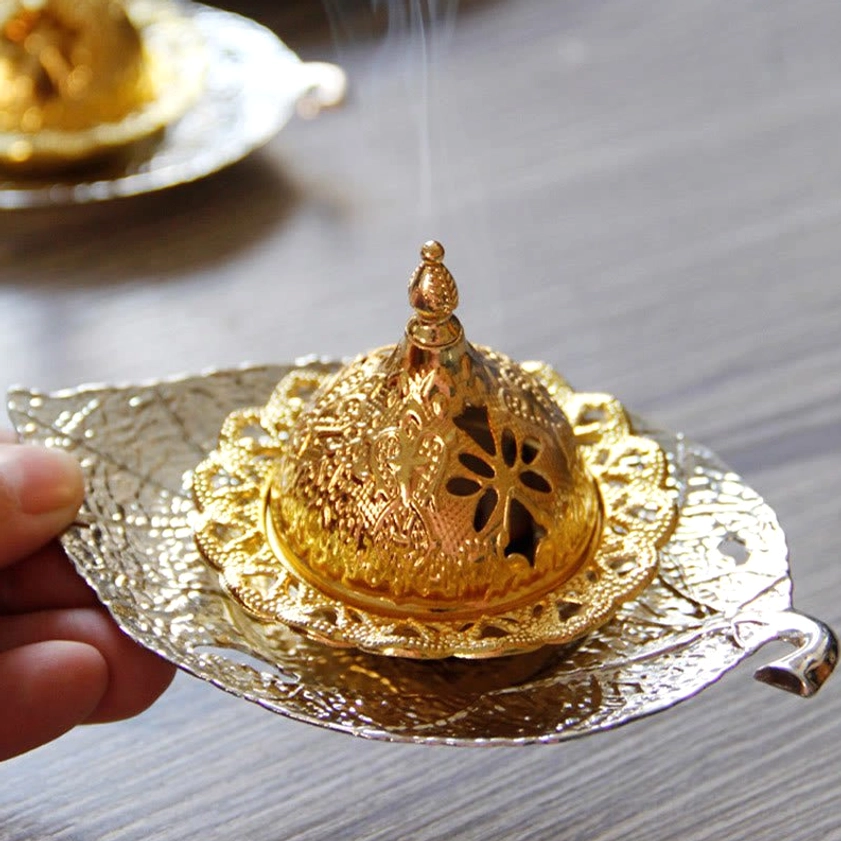 Incense burner with cone showing smoke diffusion and decorative coaster functionality