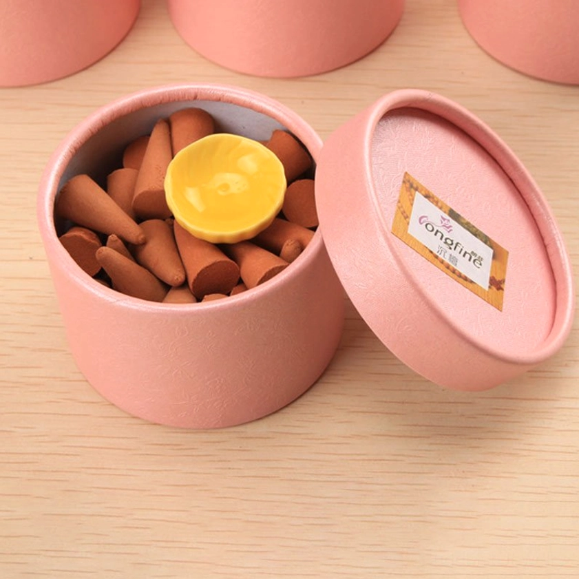 Single pink incense cone jar open showing branded label with brown cones and lotus ceramic holder