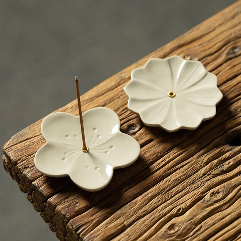 Buddhist ceramic incense holders showing cherry blossom and chrysanthemum styles for spiritual practice